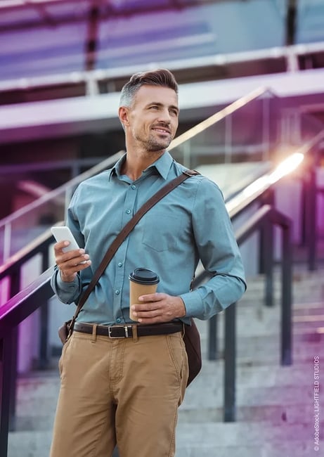 Man with smartphone and coffee mug